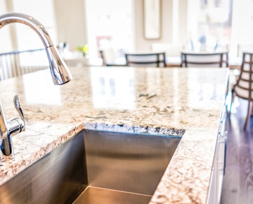 An image of a kitchen sink faucet.